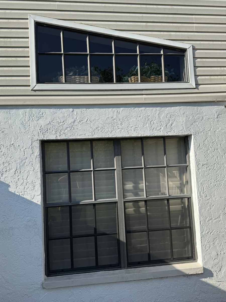 Exterior grid windows and triangular transom cleaned on a two-story Southwest Florida home